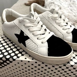 Steve Madden white and black with gold on the back heel . Super cute!